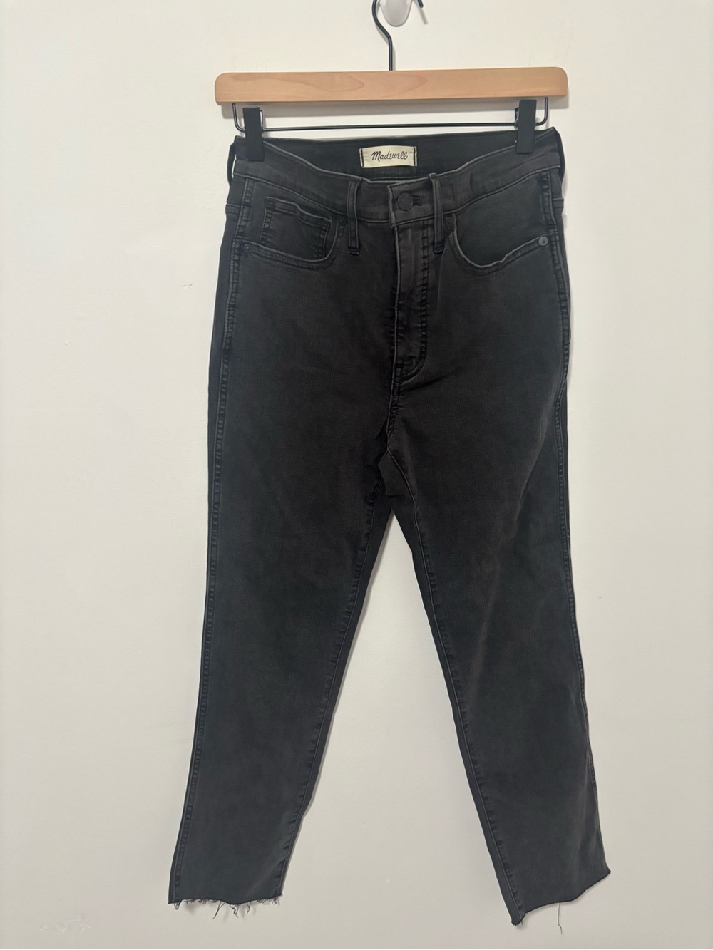 Madewell black wash stovepipe high waisted raw hem jeans